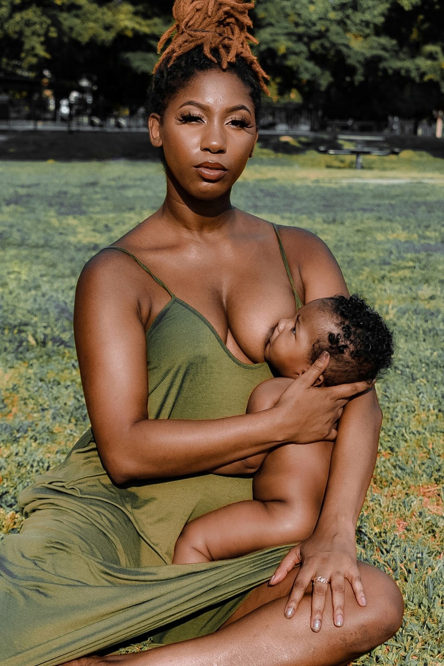 mother of color breastfeeding her baby