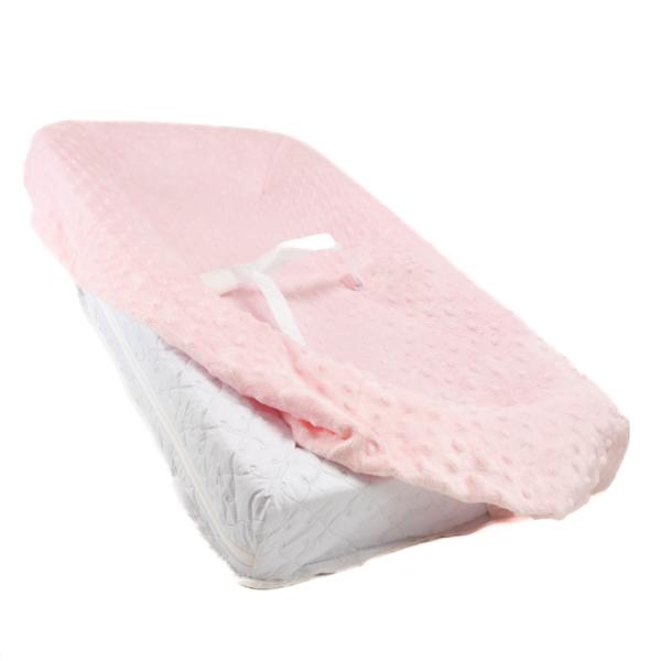 Minky dot pink cover over changing pad.